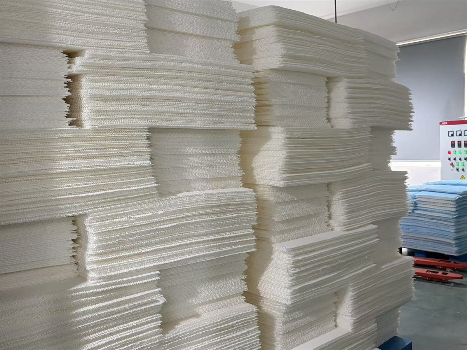 Batches of cut filter media inside the JC Filters factory